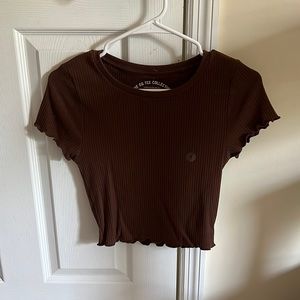 Ruffled brown crop top. A tighter fit, perfect for warm days.